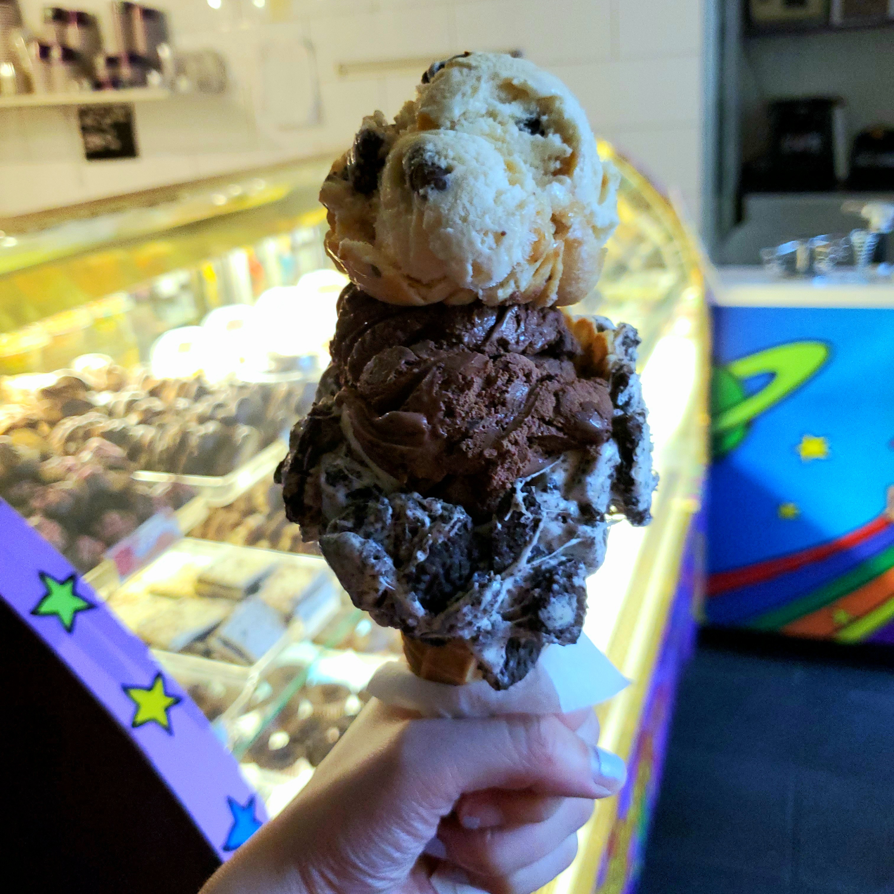 two-scoops of caramel moose prints and serious chocolate addiction on an oreo marshmellow cone